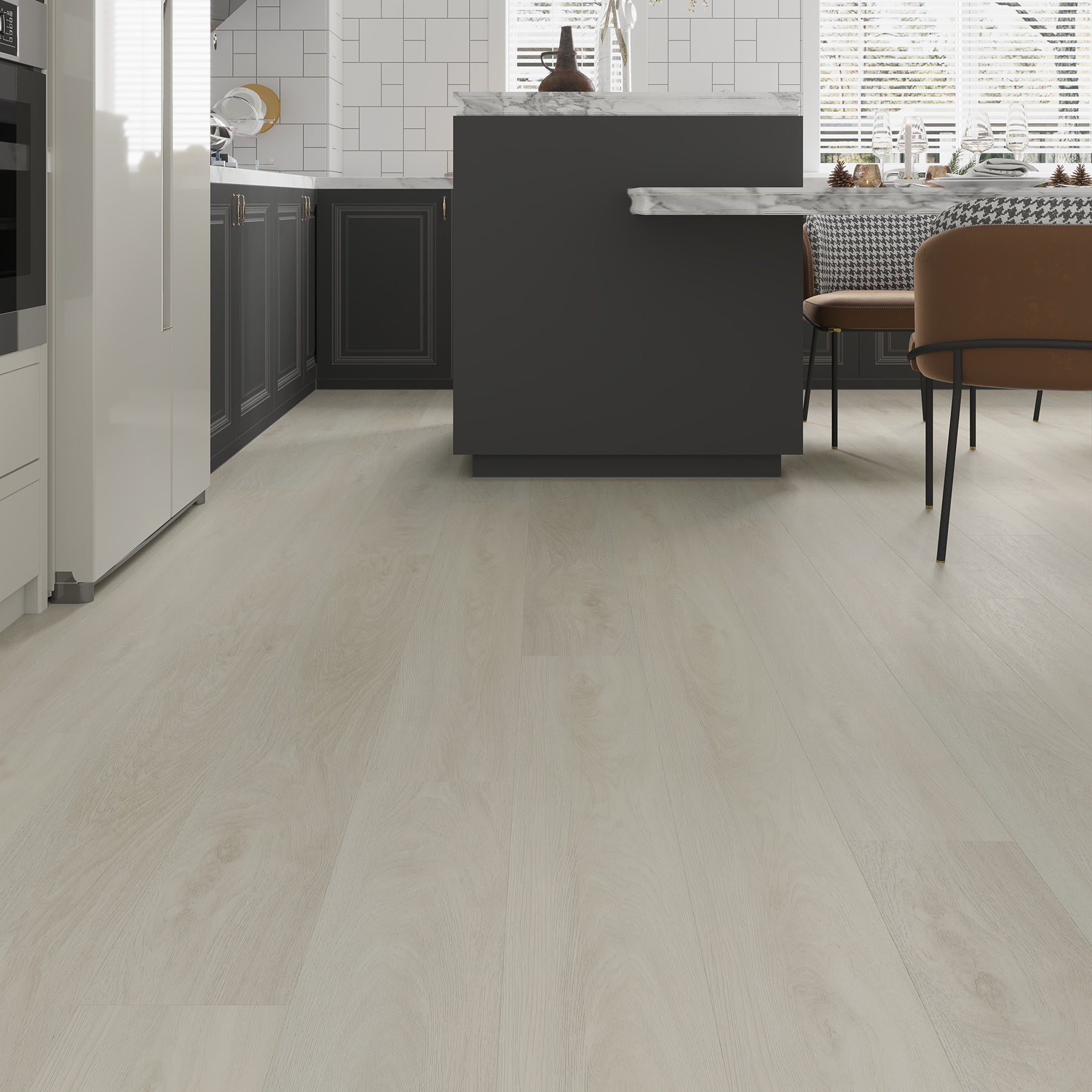 A modern kitchen with light gray laminate flooring, installed in a room with dark gray cabinets and a central island.